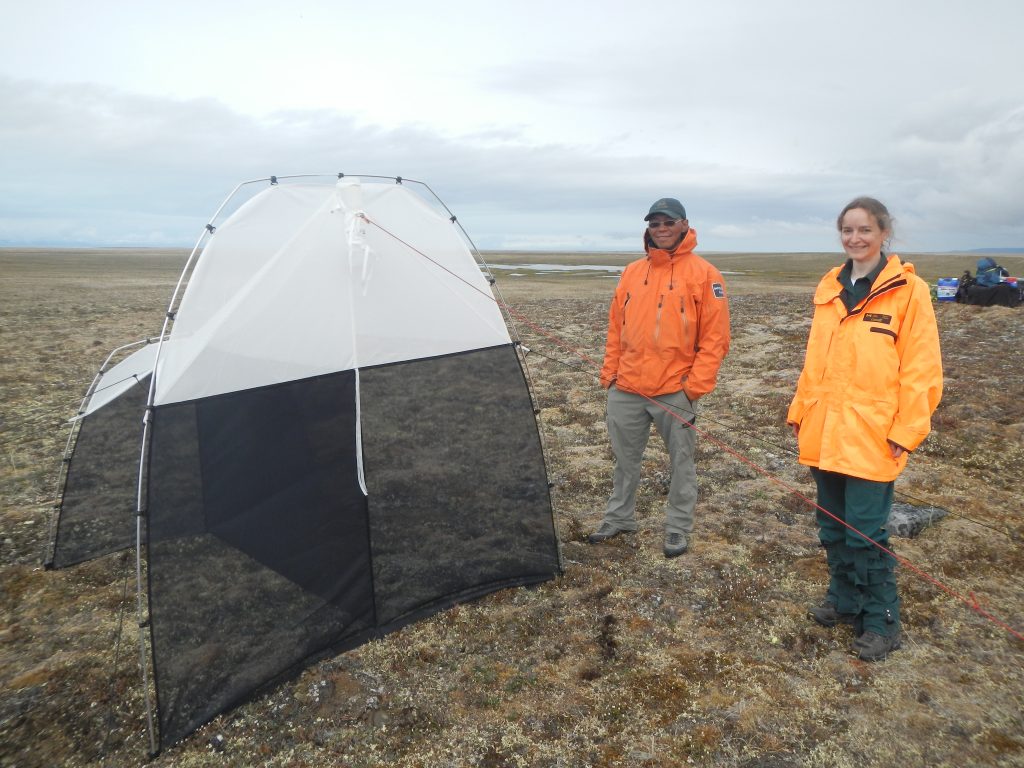 Terry Kalluk and Maryse Mahy, Parks Canada staff, taking care of our malaise trap in Sirmilik National Park
